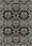 Black gothic rug with damask pattern.
