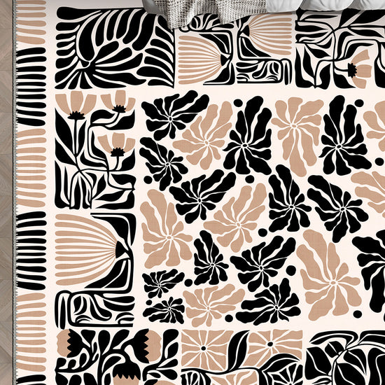 Black, beige, and white patterned rug