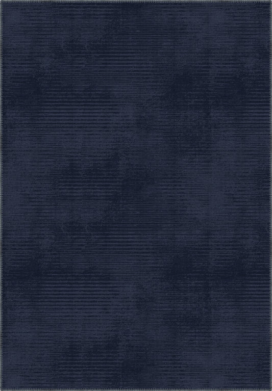 Navy blue rug with a subtle pattern in midnight blue tones.